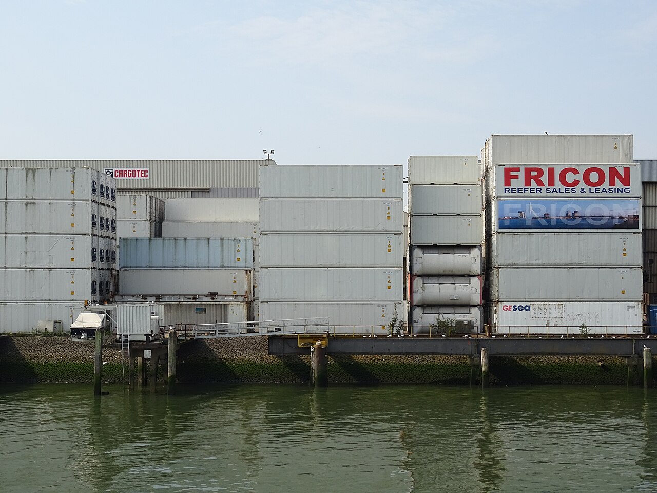 Container stacks at a port-side logistics area for shipping planning